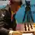 Norway's Magnus Carlsen writes down his move against India's Viswanathan Anand during the FIDE World Chess Championship in the southern Indian city of Chennai November 10, 2013. Photo: Reuters