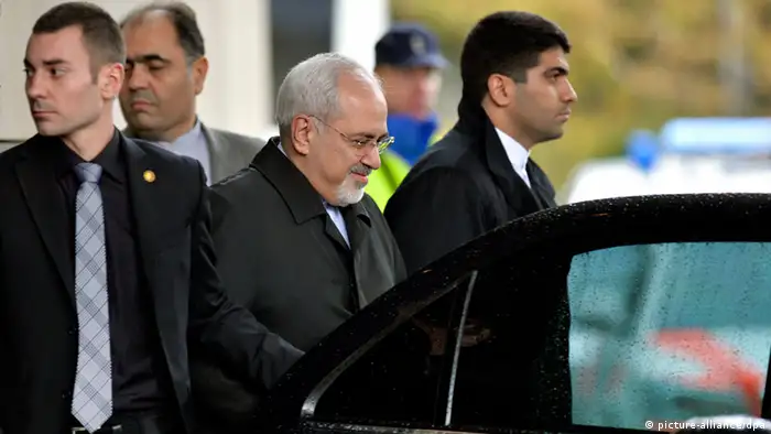 epa03961083 Iranian Foreign Minister Mohammad Javad Zarif (C) leaves the hotel, during talks over Iran's nuclear programme in Geneva, Switzerland, 22 November 2013. Six world powers and Iran have narrowed gaps on a deal to curb Tehran's nuclear programme in return for suspended sanctions, but diplomats said that a full consensus was still lacking in Geneva. Diplomats from Britain, China, France, Russia, the United States and Germany were working with their Iranian counterparts on the technical steps to limit the enrichment of uranium, to ensure that Iran's uranium stock cannot be used for nuclear weapons, and to stop work on a new plutonium-producing reactor at Arak. EPA/MARTIAL TREZZINI