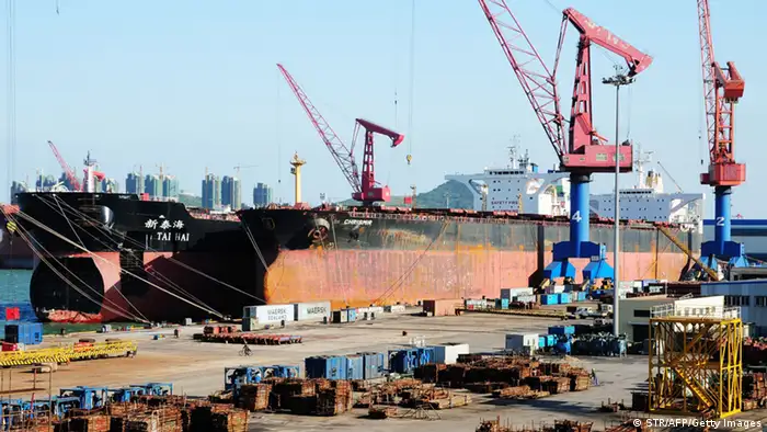 This photo taken on October 17, 2011 shows ships waiting to be loaded at the harbour in Qingdao, in northeast China's Shandong province. China said its economy grew at a slower pace in the third quarter as government efforts to tame inflation and turbulence in Europe and the United States curbed business activity, as gross domestic product in the world's second-largest economy grew 9.1 percent year-on-year in the quarter, the National Bureau of Statistics (NBS) said, compared with a 9.5 percent year-on-year expansion in the second quarter. CHINA OUT AFP PHOTO (Photo credit should read STR/AFP/Getty Images)