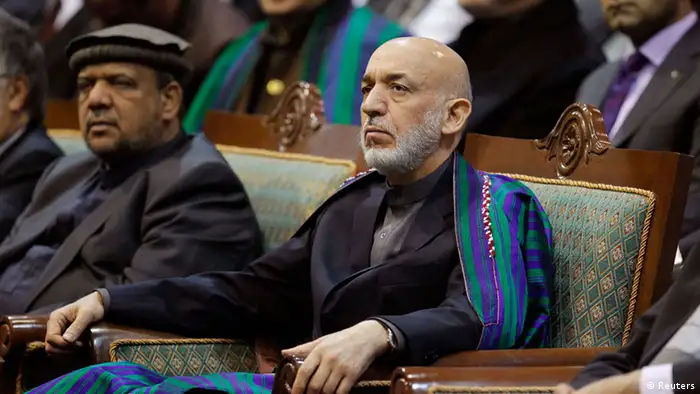 Afghan President Hamid Karzai attends the last day of the Loya Jirga, in Kabul November 24, 2013. Karzai said on Sunday the United States needed to bring peace to Afghanistan before he would sign a security deal which will enable Washington to keep troops in the country beyond next year. REUTERS/Omar Sobhani (AFGHANISTAN - Tags: POLITICS)