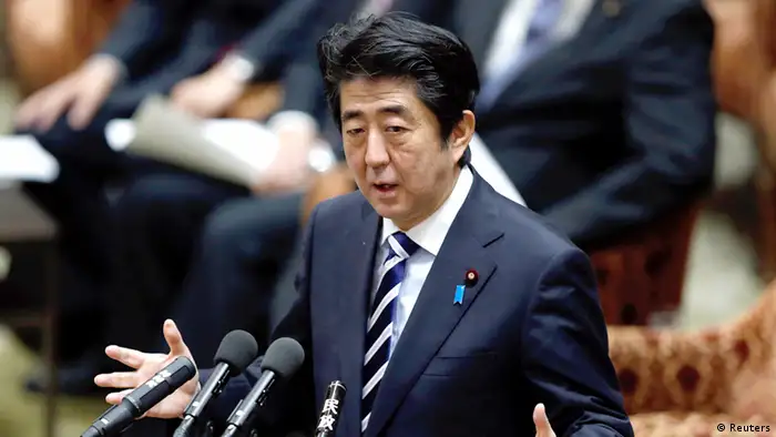 Japan's Prime Minister Shinzo Abe speaks during a lower house special committee on a state secrets act at the parliament in Tokyo November 26, 2013. The new law act would dramatically expand the definition of official secrets, and journalists convicted under it could be jailed for up to five years. REUTERS/Toru Hanai (JAPAN - Tags: POLITICS MEDIA CRIME LAW)
