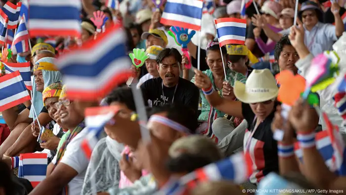 Anti-government protesters wave national flags during a protest at Government Complex in Bangkok on November 28, 2013. Thailand's embattled prime minister easily survived a parliamentary no-confidence vote on November 28 as opposition protesters kept up their fight to try to topple her government by besieging major ministries. AFP PHOTO / PORNCHAI KITTIWONGSAKUL (Photo credit should read PORNCHAI KITTIWONGSAKUL/AFP/Getty Images)