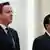 BEIJING, CHINA - DECEMBER 02: Chinese Premier Li Keqiang (R) and British Prime Minister David Cameron (L) listen to their national anthems during a welcoming ceremony inside the Great Hall of the People on December 2, 2013 in Beijing, China. At the invitation of Chinese Premier Li Keqiang, British Prime Minister David Cameron will pay an official visit to China from December 2 to 4. (Photo by Feng Li/Getty Images)