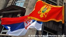 The flags of Serbia and Montenegro fly in front of the Foreign Ministry building in the Serbian capital of Belgrade
