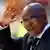 South African President Jacob Zuma waves to the crowd in the Soccer City stadium. Photo: REUTERS/Siphiwe Sibeko