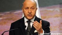 epa03961016 French Foreign Minister Laurent Fabius speaks during a High-level segment meeting at the UN Climate Change Conference COP19/CMP9 in Warsaw, Poland, 22 November 2013. The last day of the UN Climate Summit is crucial for the final negotiations on the financing of climate policy. EPA/BARTLOMIEJ ZBOROWSKI POLAND OUT