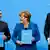 Лидеры "большой коалиции" Зигмар Габриель, Ангела Меркель и Хорст Зеехофер с копиями коалиционного договора