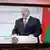 Александр Лукашенко на экране телевизора