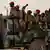 South Sudanese government troops on the back of a truck. Photo: Reuters
