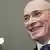 Khodorkovsky in Berlin, smiling and suited.