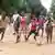 Kids play football on the streets of Guinea-Bissau