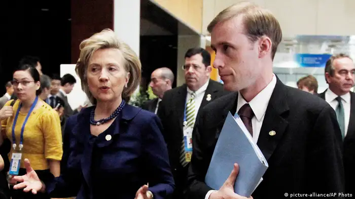 Jake Sullivan standing next to Hillary Clinton in 2009