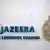 Логотип "Аль-Джазиры" на одной из стен головного офиса телеканала в Дохе