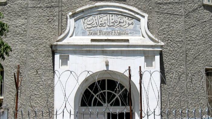 The entrance door of National Museum of Afghanistan appears behind barbed wire