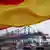Флаг Германии на фоне корабля в порту Гамбурга