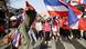 hai anti-government protesters wave Thai national flags as they march along a main road of Chinatown during their 'Bangkok Shutdown' rally in Bangkok, Thailand, 01 February 2014. hai anti-government protesters wave Thai national flags as they march along a main road of Chinatown during their 'Bangkok Shutdown' rally in Bangkok, Thailand, 01 February 2014.