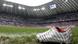 An Adidas soccer shoe in a stadium An Adidas soccer shoe in a stadium