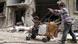 Crianças na cidade de Homs, na Síria Crianças na cidade de Homs, na Síria