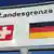 A close-up of a Swiss-German border sign - in Lörrach, Germany.