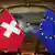 The Swiss flag pictured next to the EU flag (c) picture-alliance/dpa
