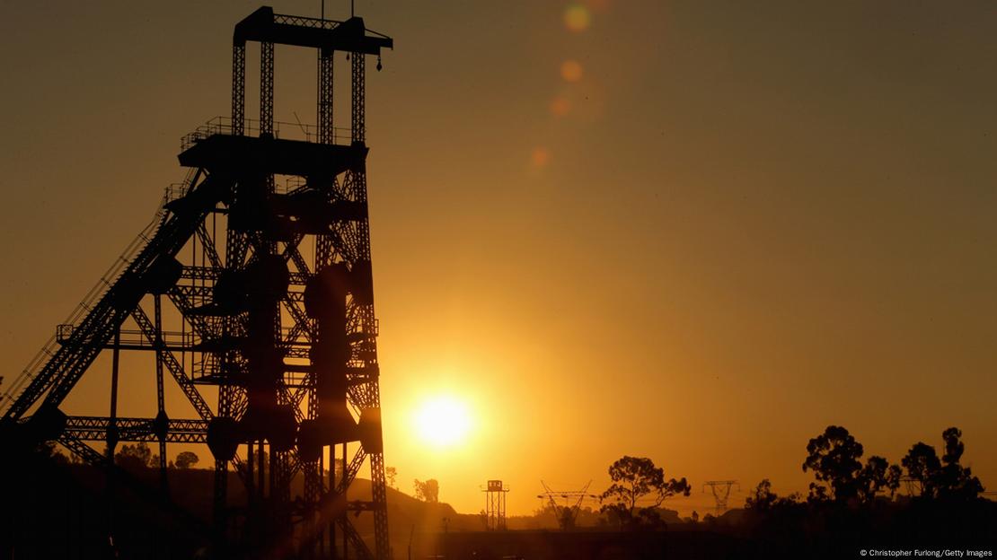 The sun rising over a derelict gold mine shaft in South Africa-