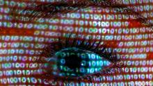 File illustration picture shows a projection of a text on the face of a woman in Berlin, June 12, 2013. Germany's foreign intelligence agency (BND) has known about the United States' surveillance and storage of German data for years, German paper Bild reported on July 15, 2013, adding the BND had actively used it in cases of Germans kidnapped abroad. Citing U.S. government sources, Bild said the BND had asked the U.S. National Security Agency (NSA) for the email and telephone records of German citizens kidnapped in Yemen or Afghanistan, to help ascertain their whereabouts and contacts. The BND was not immediately available for comment. Picture taken June 12, 2013. REUTERS/Pawel Kopczynski/Files (GERMANY - Tags: SOCIETY POLITICS)