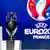 Кубок, который будет вручен победителю Евро-2016, на фоне логотипа турнира