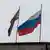 Российский флаг над захваченным демонстрантами парламентом Крыма