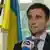 Pavlo Klimkin, with a flag in the background .