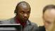 Germain Katanga with headphones in court. AFP PHOTO/ANP/MICHAEL KOOREN netherlands out - belgium out (Photo credit should read MICHAEL KOOREN/AFP/GettyImages) Germain Katanga with headphones in court. AFP PHOTO/ANP/MICHAEL KOOREN netherlands out - belgium out (Photo credit should read MICHAEL KOOREN/AFP/GettyImages)