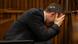 Olympic and Paralympic track star Oscar Pistorius reacts as he reaches for a bucket in the dock during his trial for the murder of his girlfriend Reeva Steenkamp, at the North Gauteng High Court in Pretoria, March 10, 2014. Pistorius broke down on Monday when a South African court heard details from the autopsy of girlfriend Reeva Steenkamp, whom the track star is accused of murdering on Valentine's Day last year. REUTERS/Siphiwe Sibeko Olympic and Paralympic track star Oscar Pistorius reacts as he reaches for a bucket in the dock during his trial for the murder of his girlfriend Reeva Steenkamp, at the North Gauteng High Court in Pretoria, March 10, 2014. Pistorius broke down on Monday when a South African court heard details from the autopsy of girlfriend Reeva Steenkamp, whom the track star is accused of murdering on Valentine's Day last year. REUTERS/Siphiwe Sibeko
