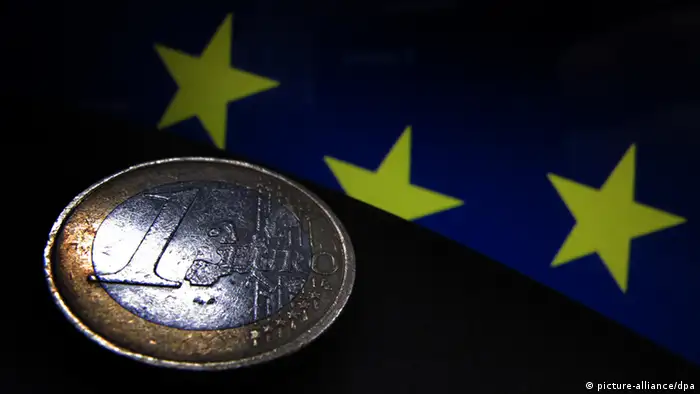 Euro coin on EU flag