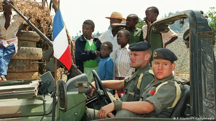 French soldiers patrol 26 June 1994 near Kayove, some 60 kilometers north of the border with Zaire