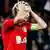 Bayer Leverkusen captain Simon Rolfes reacts after missing a penalty against PSG. Photo: EPA