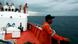 Members of a rescue team stand on the deck of a Basarnas rescue ship during a search and rescue operation to find the missing Malaysia Airlines flight MH370, in the Andaman Sea, March 15, 2014. REUTERS/Junaidi Hanafiah Members of a rescue team stand on the deck of a Basarnas rescue ship during a search and rescue operation to find the missing Malaysia Airlines flight MH370, in the Andaman Sea, March 15, 2014. REUTERS/Junaidi Hanafiah
