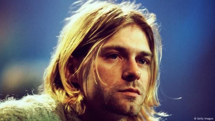 Kurt Cobain looks pensively ahead while performing for MTV