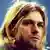 Kurt Cobain on stage during the MTV Unplugged concert, with a close-up of his face