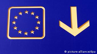 EU flag with an arrow pointing down