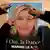 Hands seen putting up a Marine Le Pen poster. (Photo: REUTERS/Eric Gaillard)