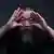 Ai Weiwei opening his eyes with his hands, Copyright: Gao Yuan - MartinGropius Bau