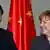 German Chancellor Angela Merkel and China's President Xi Jinping arrive for an agreement signing at the Chancellery in Berlin March 28, 2014.