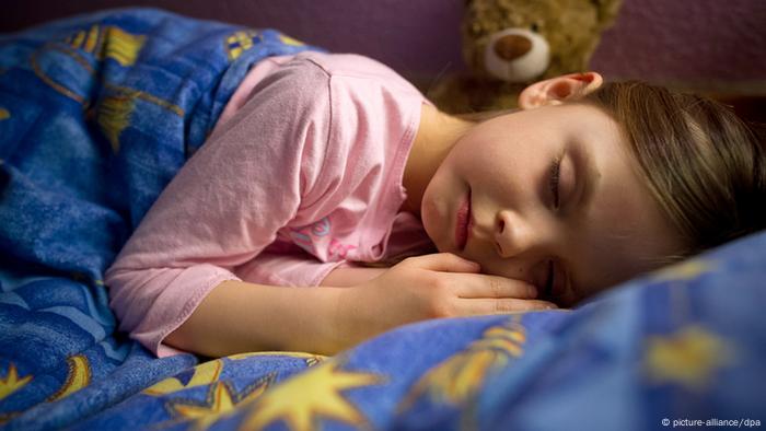 Germany Sleeping child with teddy bear