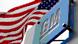 The American carmaker General Motors' logo in front of the American flag. The American carmaker General Motors' logo in front of the American flag.