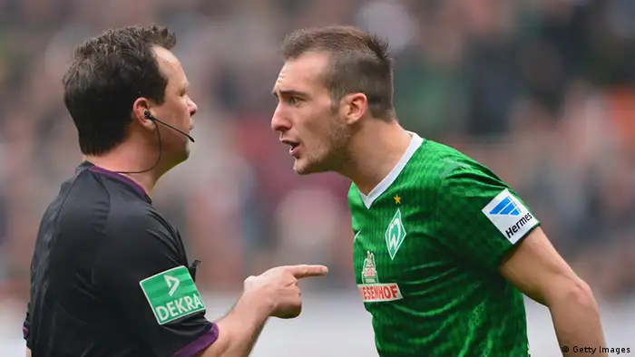Bremen's Luca Caldirola yells at a referee