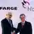 Rolf Soiron (L) shakes hands with Lafarge CEO Bruno Lafont. Foto: Christian Hartmann/rtr