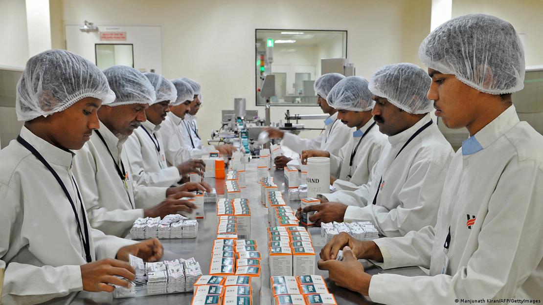Workers at the secondary packing unit of Himalaya Drug Company pack plastic tablet containers in their respective outer carton boxes in Bangalore
