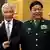 U.S. Defense Secretary Chuck Hagel (L) and his Chinese counterpart Chang Wanquan wave to members of the media prior to their meeting at the Chinese Defense Ministry headquarters in Beijing April 8, 2014.