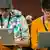 Two young people holding Apple laptops, Copyright: dpa - Bildfunk