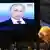 Зрители наблюдают за выступлением Владимира Путина по ТВ