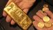 Gold coins and a gold bar Gold coins and a gold bar